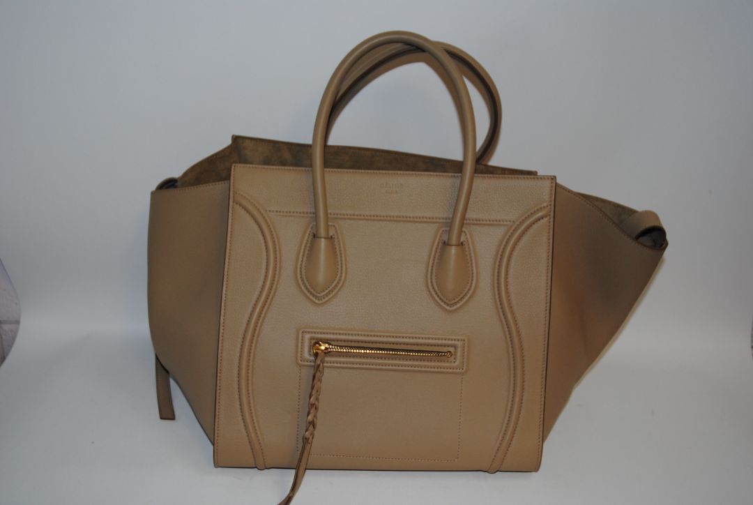 taupe Celine luggage phantom tote, Height: ~12″ (30.5 cm) Width (body): ~11″ (28 cm) Depth: ~6″ (15 cm) Drop of handles: ~5″ (These mirror typical Céline Luggage medium / mini dimensions)