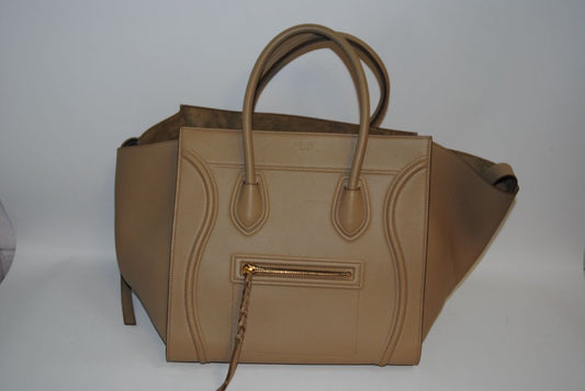 taupe Celine luggage phantom tote, Height: ~12″ (30.5 cm) Width (body): ~11″ (28 cm) Depth: ~6″ (15 cm) Drop of handles: ~5″ (These mirror typical Céline Luggage medium / mini dimensions)