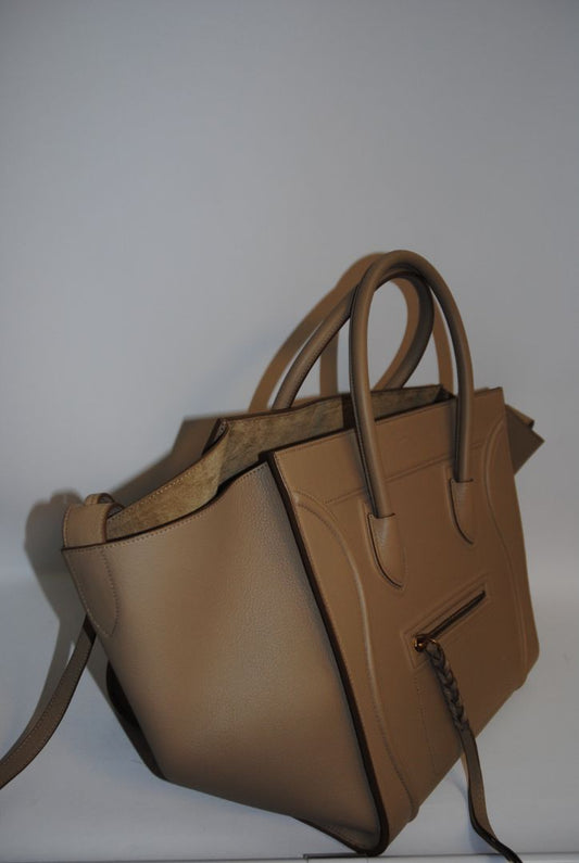 taupe Celine luggage phantom tote, Height: ~12″ (30.5 cm) Width (body): ~11″ (28 cm) Depth: ~6″ (15 cm) Drop of handles: ~5″ (These mirror typical Céline Luggage medium / mini dimensions)