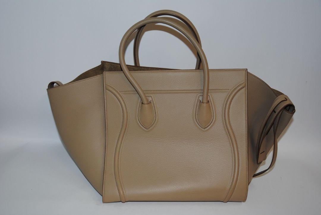 taupe Celine luggage phantom tote, Height: ~12″ (30.5 cm) Width (body): ~11″ (28 cm) Depth: ~6″ (15 cm) Drop of handles: ~5″ (These mirror typical Céline Luggage medium / mini dimensions)