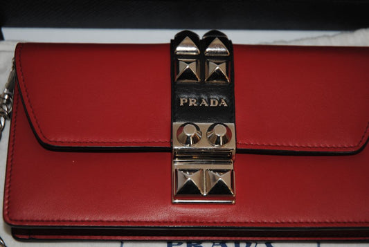 crimson red Prada flap chain bag, Width: 8.5 inches (21.5 cm) Height: 5 inches (12.5 cm) Depth: 2 inches (5 cm) Chain Strap Drop: 22 inches (56 cm)