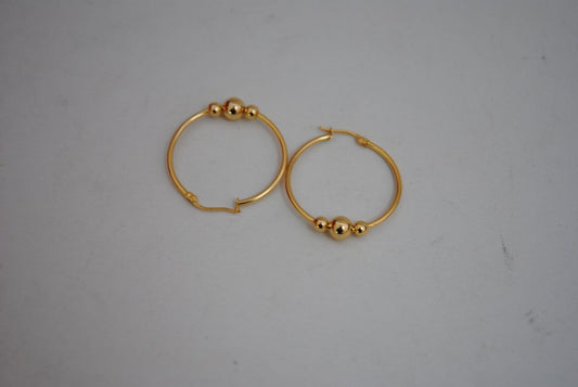 gold NA classic triple ball design hoops, **Hoop Diameter:** Approximately 35mm (1.4”) **Tube Thickness:** Approximately 2mm **Ball Beads:** 3 graduated sizes Large center ball: ~8mm Medium balls: ~6mm each Small ball: ~4mm **Weight:** Approximately 4-6g