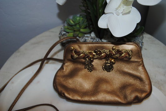 copper gold Braccialini Designer bag, Width: ~12 in (30 cm) Height: ~7.5 in (19 cm) Depth: ~4 in (10 cm) Strap Drop: ~18–20 in (shoulder length)