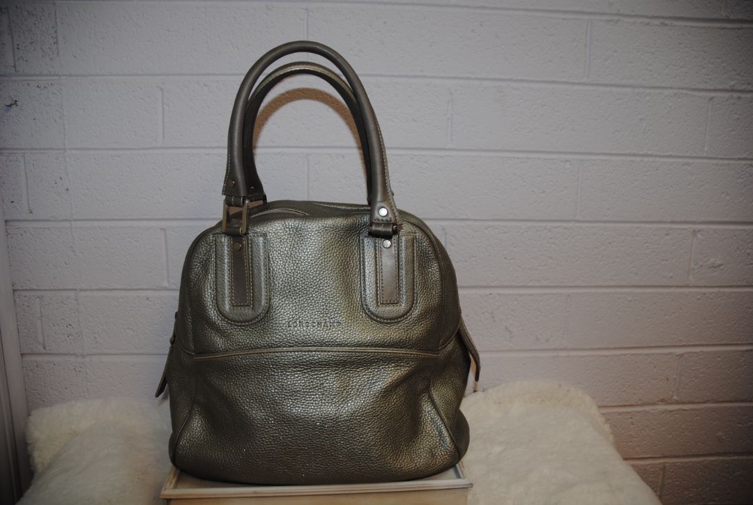 Metallic silver Longchamp bowling bag, Width: ~13 in (33 cm) Height: ~12 in (30 cm) Depth: ~5 in (13 cm) Handle Drop: ~5–6 in (hand or forearm carry)