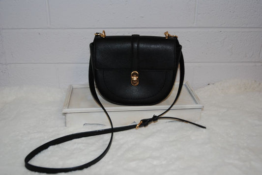 black Oryany half moon cross body, Width: 9–9.5 in Height: 7 in Depth: 2.5–3 in Strap Drop: Adjustable 19–23 in