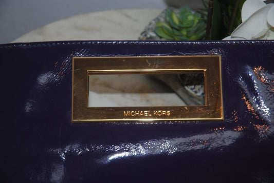 purple Michael Kors clutch with magnet closure, small