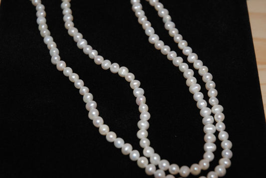 white NA opera necklace