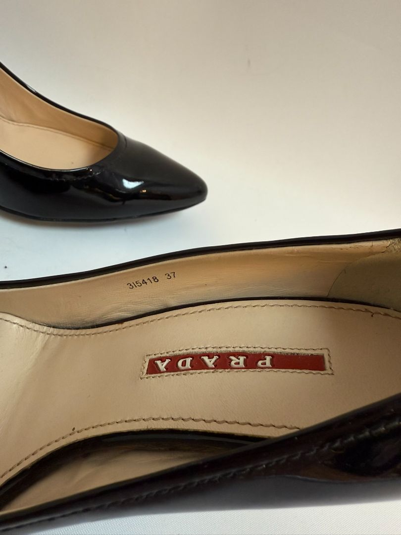black Prada patent heels