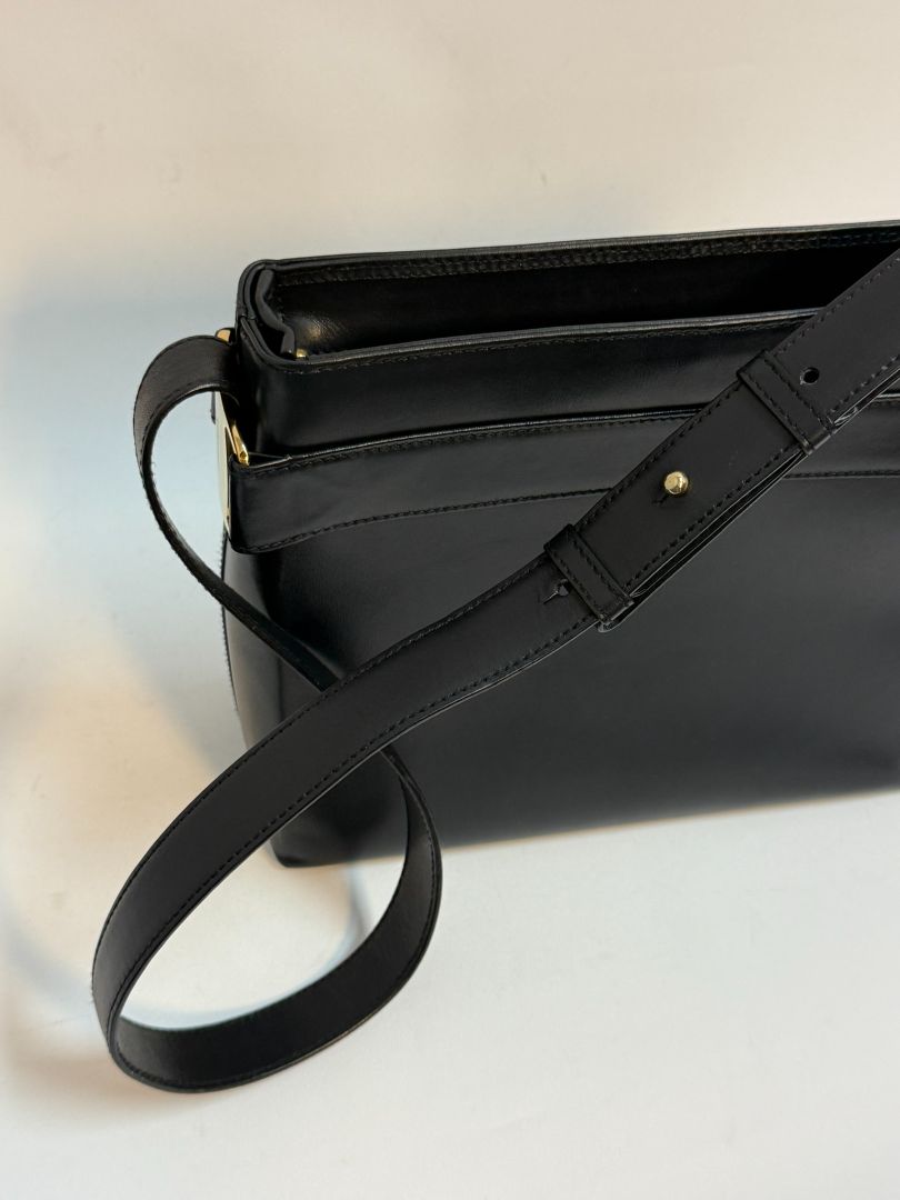 navy blue Ferragamo shoulder bag, Dimensions (Approximate): Height: 9” (22.9 cm) Width: 11.5” (29.2 cm) Depth: 4” (10.2 cm) Strap Drop: Adjustable from 10” to 13” (25.4 to 33 cm)