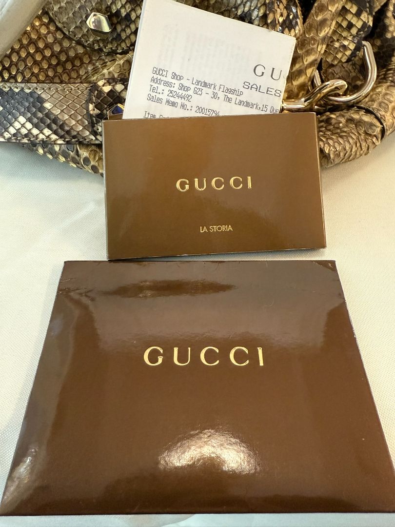 Taupe/ brown / beige Gucci Dome Pytho Satchel with Lucite Handles, Height: 9 in (22.8 cm) Width: 13.5 in (34.3 cm) Depth: 6 in (15.2 cm) Handle Drop: 5 in (12.7 cm) Strap Drop (detachable): approx. 18 in (45.7 cm)