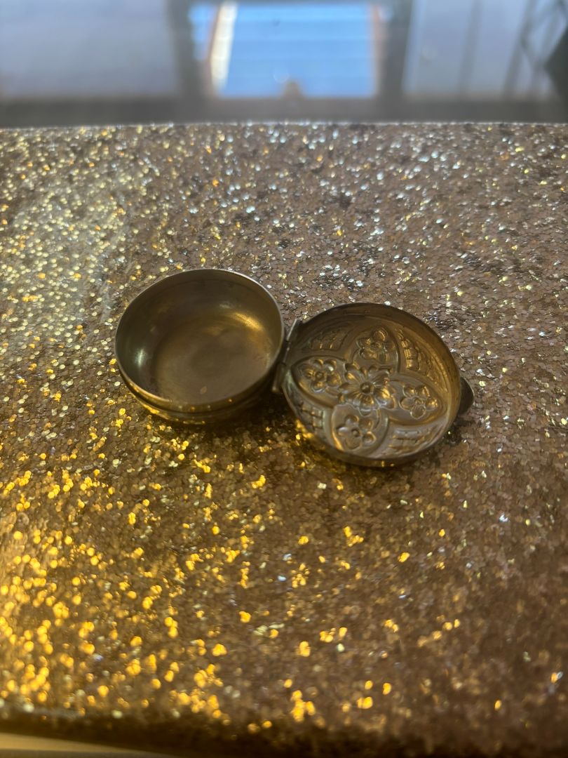 sterling silver NA pill box, π Dimensions (approx.): Diameter: 1.5 inches (3.8 cm) Depth: 0.6 inches (1.5 cm) Opening: Hinged lid with secure snap closure