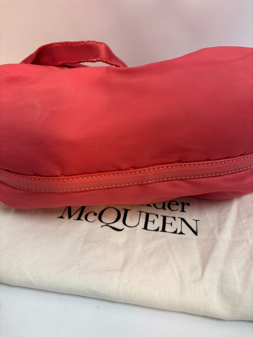 red Alexander McQueen drawstring bag, Length: 10 in Height: 6 in Depth: 3.5 in Strap Drop: Adjustable (approx. 12β20 in)