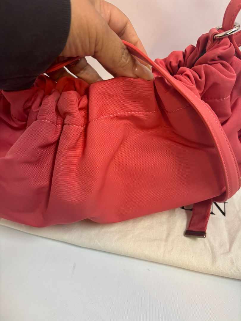 red Alexander McQueen drawstring bag, Length: 10 in Height: 6 in Depth: 3.5 in Strap Drop: Adjustable (approx. 12β20 in)