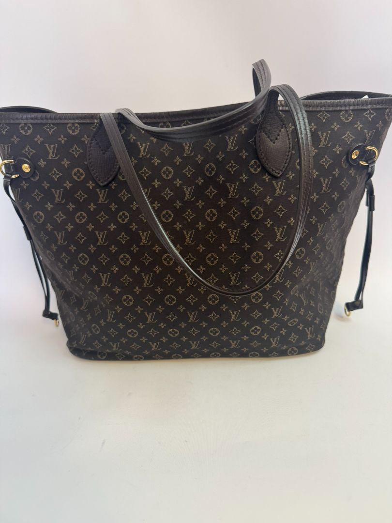 brown Louis Vuitton Mini Lin Monogram Tote โ Rare Discontinued Style (Cabas Sac), Height: 13 in Depth: 6.5 in Handle Drop: 8.5 in (Note: These measurements align with the Mini Lin or Idylle Cabas tote sizing.)
