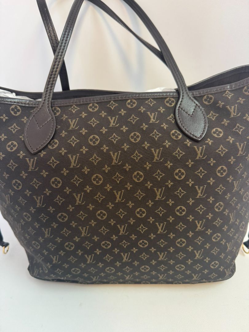 brown Louis Vuitton Mini Lin Monogram Tote โ Rare Discontinued Style (Cabas Sac), Height: 13 in Depth: 6.5 in Handle Drop: 8.5 in (Note: These measurements align with the Mini Lin or Idylle Cabas tote sizing.)