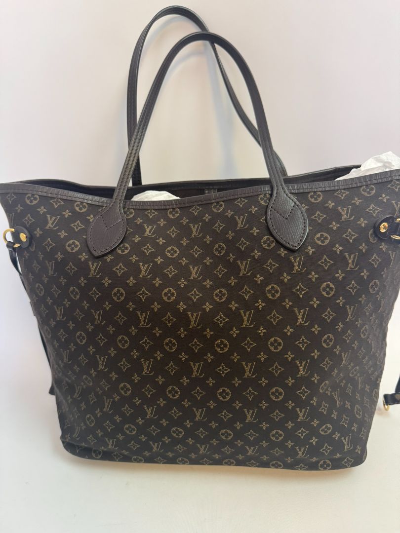 brown Louis Vuitton Mini Lin Monogram Tote โ Rare Discontinued Style (Cabas Sac), Height: 13 in Depth: 6.5 in Handle Drop: 8.5 in (Note: These measurements align with the Mini Lin or Idylle Cabas tote sizing.)