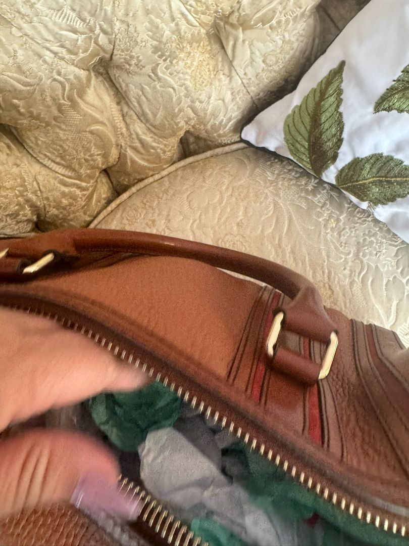 Cognac brown with multi-stripe accents in oxblood, black, and tan (subtle nod to Burberry’s house check palette) Burberry Model: Likely from the Banner or Orchard satchel line (structured silhouette with rolled handles and stripe accents), Length: 13 in (