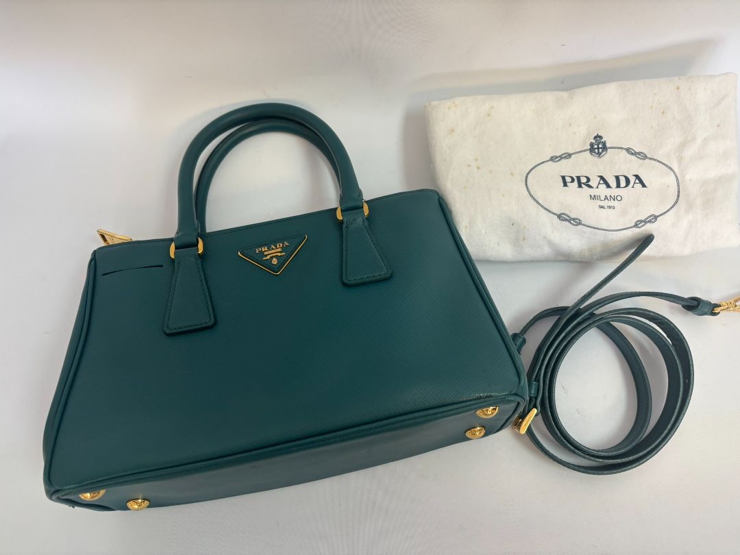 deep teal Prada Model: Double Zip Lux Tote (also known as Galleria Tote), Width: 11.5 inches (29 cm) Height: 8 inches (20 cm) Depth: 5 inches (13 cm) Handle Drop: 4 inches (10 cm) Strap Drop: 19–21 inches adjustable (48–53 cm)