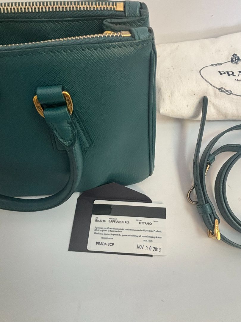 deep teal Prada Model: Double Zip Lux Tote (also known as Galleria Tote), Width: 11.5 inches (29 cm) Height: 8 inches (20 cm) Depth: 5 inches (13 cm) Handle Drop: 4 inches (10 cm) Strap Drop: 19–21 inches adjustable (48–53 cm)
