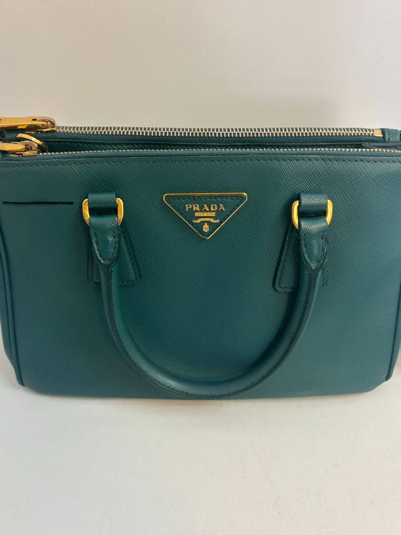 deep teal Prada Model: Double Zip Lux Tote (also known as Galleria Tote), Width: 11.5 inches (29 cm) Height: 8 inches (20 cm) Depth: 5 inches (13 cm) Handle Drop: 4 inches (10 cm) Strap Drop: 19–21 inches adjustable (48–53 cm)