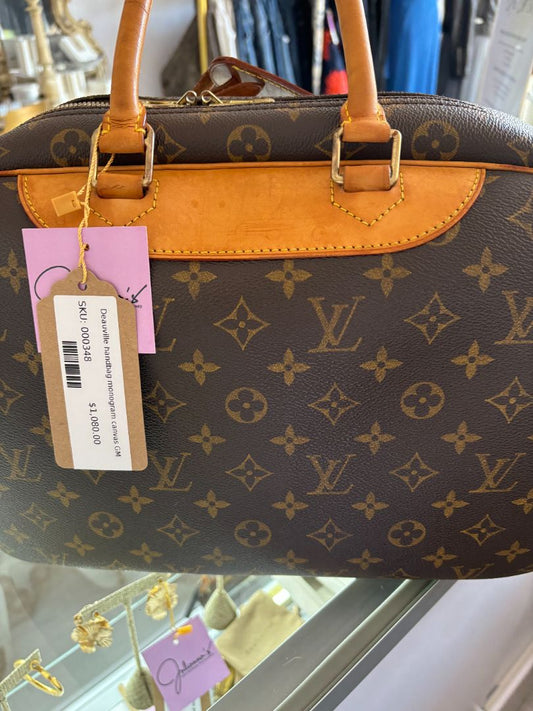 Back of Louis Vuitton Deauville Monogram canvas bag with rounded top and gold-tone hardware