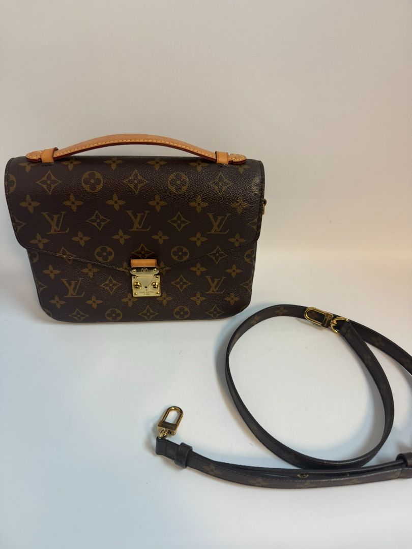 Louis Vuitton Pochette Métis in Monogram canvas, featuring the iconic LV logo print, a structured flap design, gold-tone hardware, and a detachable shoulder strap for versatile wear. This elegant crossbody bag is perfect for both day and night occasions.