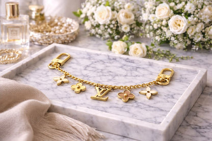 gold Louis Vuitton bag chain extender