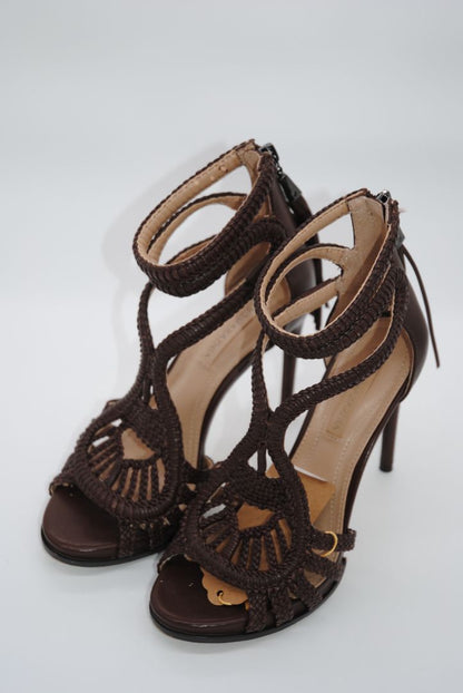 Side view of strappy BCBG Max Azria open toe heels.