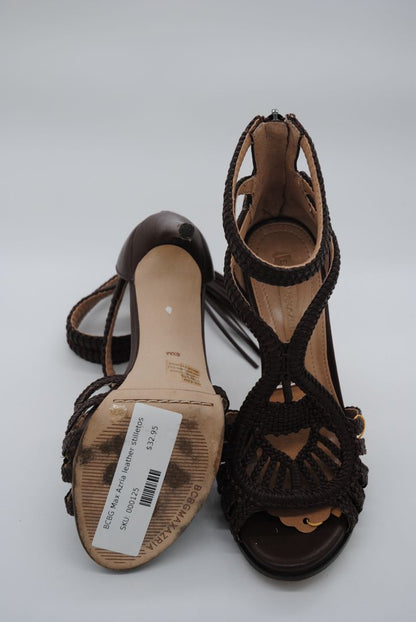 Evening heels with strappy design and stiletto heel.