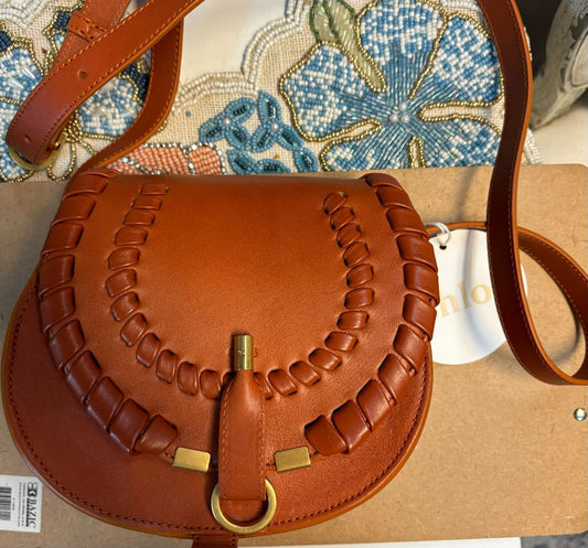 Chloé Marcie mini saddle crossbody bag in smooth leather with curved flap and topstitching