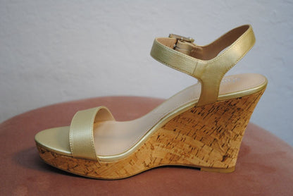 Close-up of metallic finish and sandal straps

