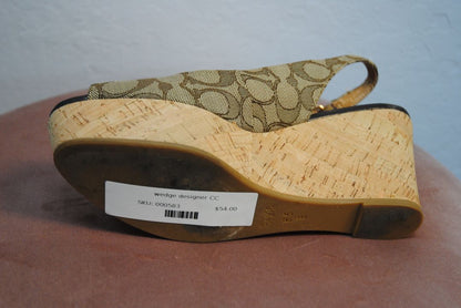 Coach Women's Tan Insignia Ferry Peep Toe Wedge Heels in Size 8.5B, featuring a leather upper, open toe design, and wedge heel with signature Coach logo detailing.
