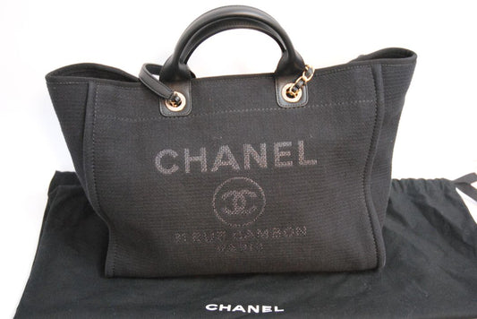 black Chanel Deauville Large Shopping Tote in Black Canvas with Leather Trim:, Length: 15 in (38 cm) Height: 11.5 in (29 cm) Depth: 6 in (15 cm) Handle Drop (top handles): 4.5 in Strap Drop (shoulder chains): 10 in