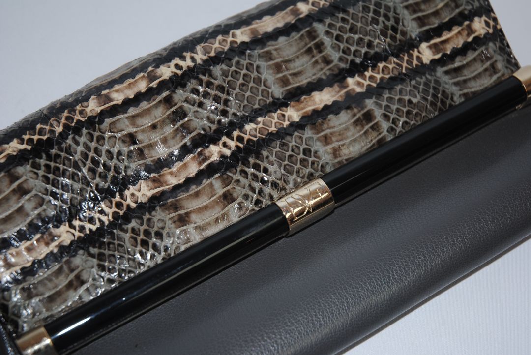 snake skin and gray Diane von Furstenberg clutch, Length: 11” Height: 6” Depth: 1.5” Closure: Bar frame with hinge clasp