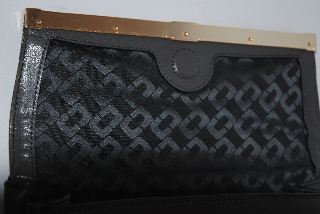 snake skin and gray Diane von Furstenberg clutch, Length: 11” Height: 6” Depth: 1.5” Closure: Bar frame with hinge clasp