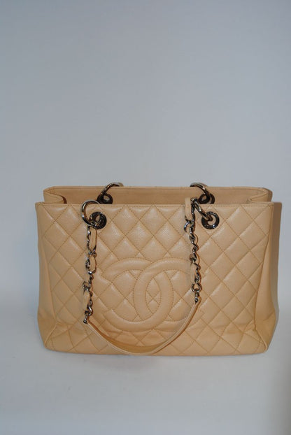 Beige Caviar Chanel Grand Shopping Tote (GST) in Caviar Leather with silver-tone, Length: 13.5 in Height: 10 in Depth: 5 in Handle Drop: 9 in
