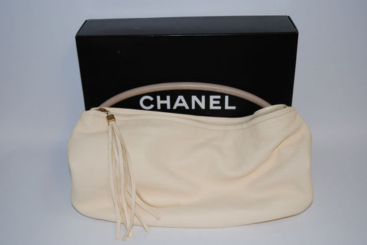 Ivory Chanel hobo shoulder leather tassel, Length: 16 in Height: 10 in Depth: 5 in Handle Drop: 9 in