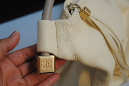 Ivory Chanel hobo shoulder leather tassel, Length: 16 in Height: 10 in Depth: 5 in Handle Drop: 9 in