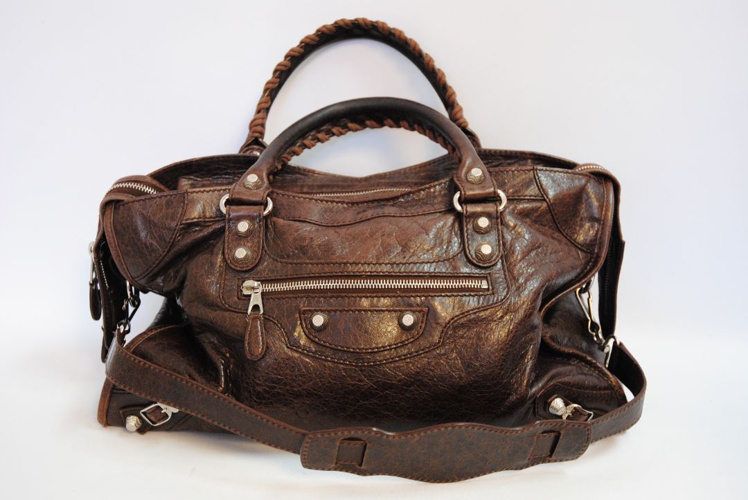 brown Balenciaga Classic City Bag – Distressed Brown Leather with Silver Hardware, Length: 15 in (38 cm) Height: 10 in (25 cm) Depth: 5.5 in (14 cm) Handle Drop: 4 in Strap Drop: 10–12 in (adjustable, removable shoulder strap)