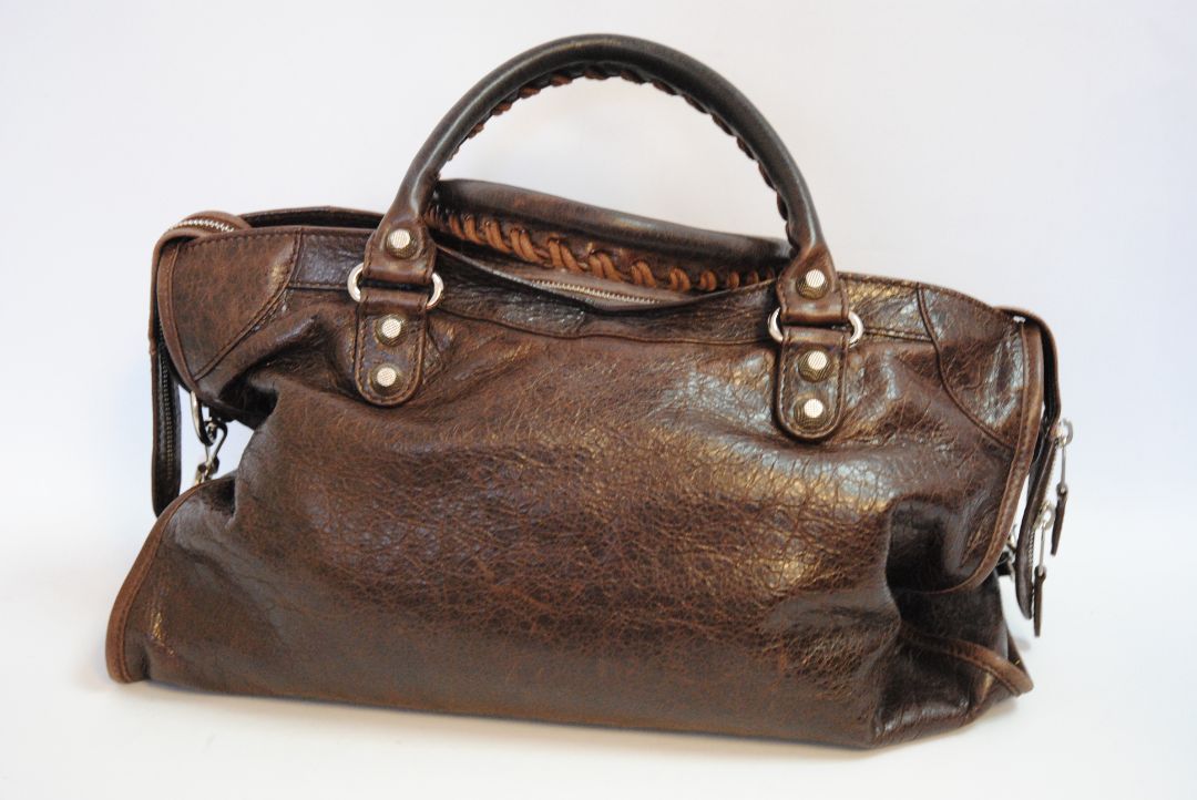 brown Balenciaga Classic City Bag – Distressed Brown Leather with Silver Hardware, Length: 15 in (38 cm) Height: 10 in (25 cm) Depth: 5.5 in (14 cm) Handle Drop: 4 in Strap Drop: 10–12 in (adjustable, removable shoulder strap)