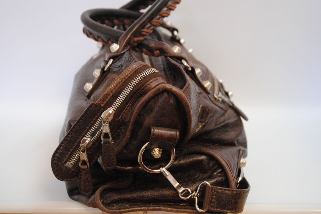 brown Balenciaga Classic City Bag – Distressed Brown Leather with Silver Hardware, Length: 15 in (38 cm) Height: 10 in (25 cm) Depth: 5.5 in (14 cm) Handle Drop: 4 in Strap Drop: 10–12 in (adjustable, removable shoulder strap)