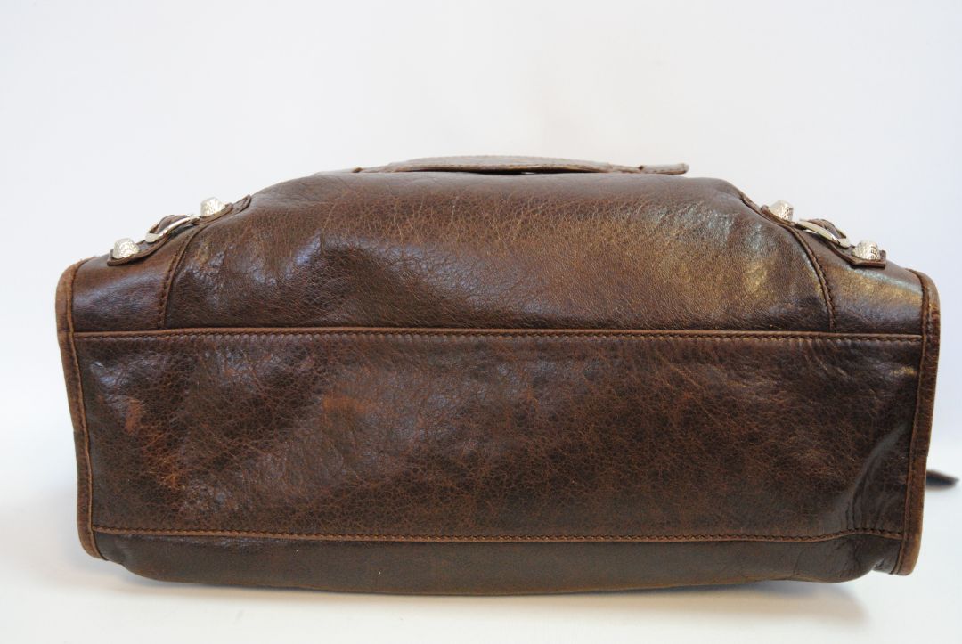 brown Balenciaga Classic City Bag – Distressed Brown Leather with Silver Hardware, Length: 15 in (38 cm) Height: 10 in (25 cm) Depth: 5.5 in (14 cm) Handle Drop: 4 in Strap Drop: 10–12 in (adjustable, removable shoulder strap)