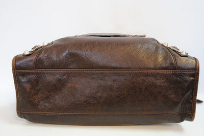 brown Balenciaga Classic City Bag – Distressed Brown Leather with Silver Hardware, Length: 15 in (38 cm) Height: 10 in (25 cm) Depth: 5.5 in (14 cm) Handle Drop: 4 in Strap Drop: 10–12 in (adjustable, removable shoulder strap)