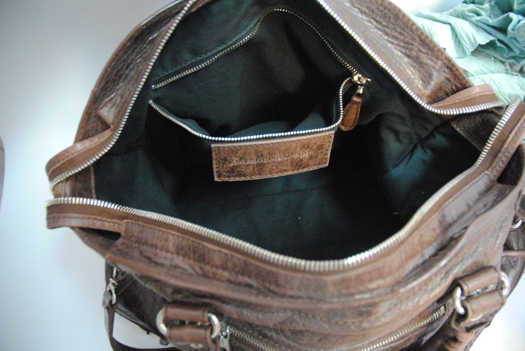 brown Balenciaga Classic City Bag – Distressed Brown Leather with Silver Hardware, Length: 15 in (38 cm) Height: 10 in (25 cm) Depth: 5.5 in (14 cm) Handle Drop: 4 in Strap Drop: 10–12 in (adjustable, removable shoulder strap)