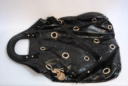 black Stella McCartney grommet patent eco tote, Length: 18 in (46 cm) Height: 16 in (41 cm) Depth: 5 in (13 cm) Top Handle Drop: 4 in Shoulder Strap Drop: Adjustable up to 20 in (Ideal for top-handle or crossbody wear)