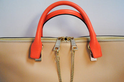 blush and coral Chloe colorblock leather tote, Length: 13.5 in Height: 9.5 in Depth: 6 in Handle Drop: 5 in Strap Drop: 17 in (adjustable, removable wide strap)