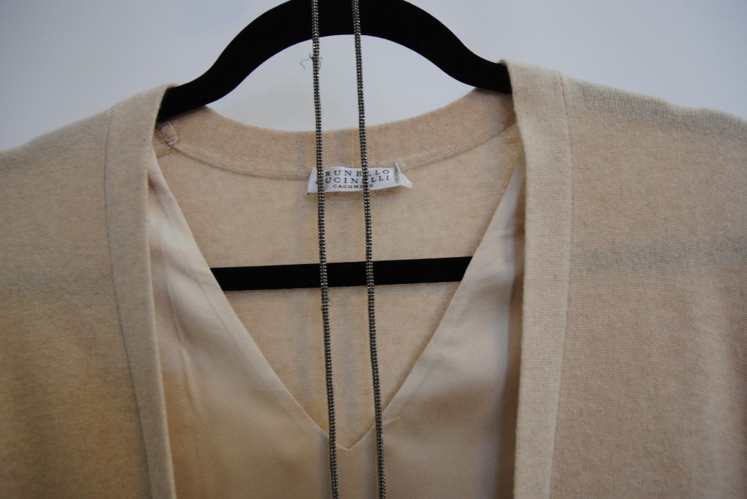 beige Brunello Cucinelli cashmere and silk belted top, Bust (flat): 19 in Length (shoulder to hem): 26 in (front), 24.5 in (back) Shoulder Width: 17 in Fit: Relaxed, draped silhouette Closure: Open front with inner satin tie detail