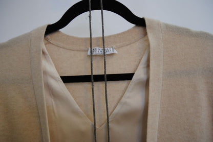 beige Brunello Cucinelli cashmere and silk belted top, Bust (flat): 19 in Length (shoulder to hem): 26 in (front), 24.5 in (back) Shoulder Width: 17 in Fit: Relaxed, draped silhouette Closure: Open front with inner satin tie detail