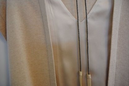 beige Brunello Cucinelli cashmere and silk belted top, Bust (flat): 19 in Length (shoulder to hem): 26 in (front), 24.5 in (back) Shoulder Width: 17 in Fit: Relaxed, draped silhouette Closure: Open front with inner satin tie detail