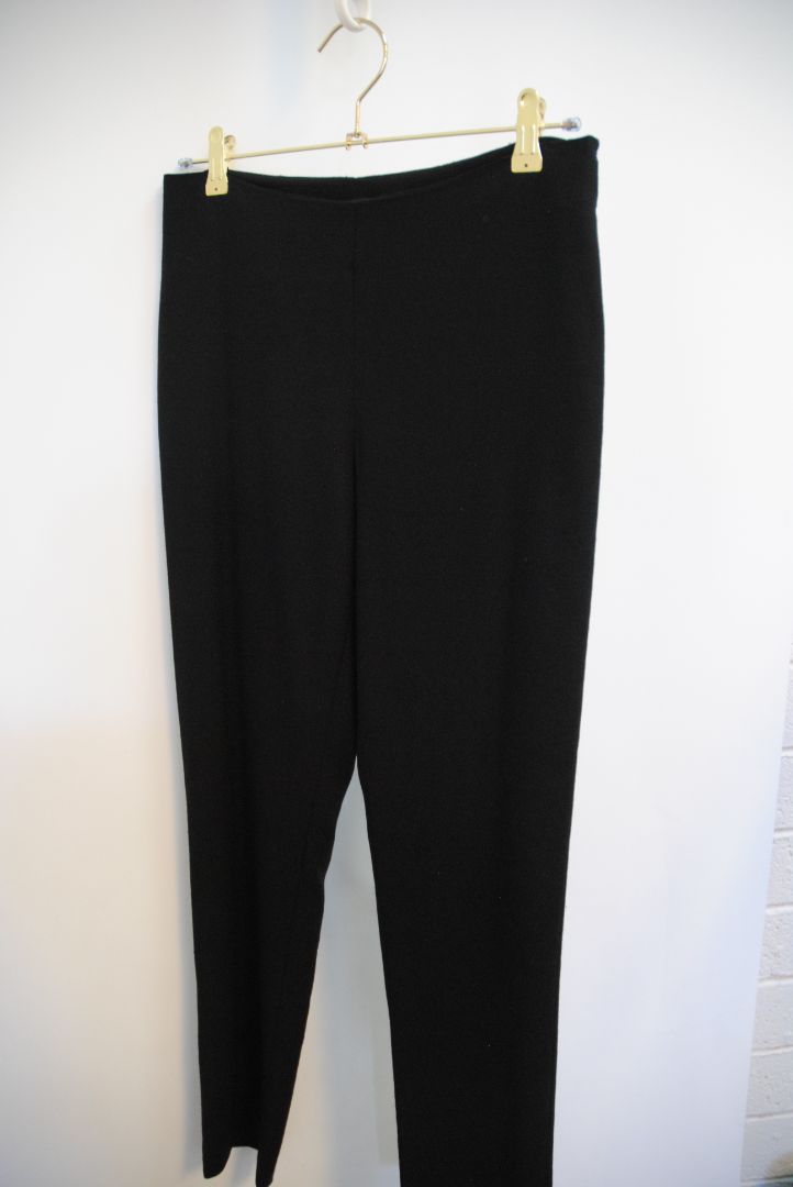 black The Row stretch knit pants, Waist (flat, unstretched): 13 in Rise: 11 in Inseam: 30 in Hip: 17 in Leg Opening: 7 in Fit: Slim leg, tapered Material: Midweight stretch knit (likely viscose-blend)